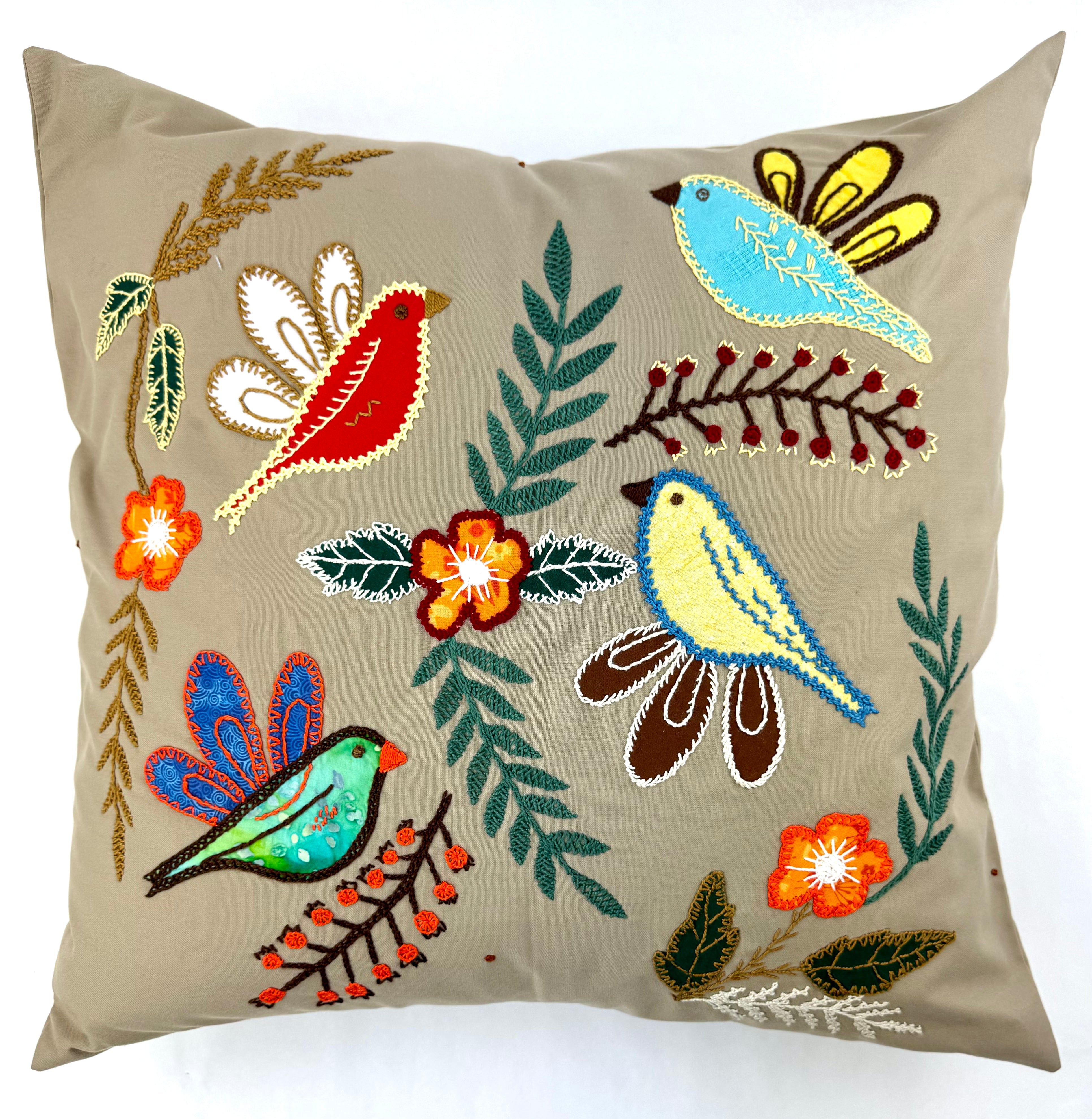 Four Birds Design by Kate Juett. Hand embroidered on tan. Honduras Threads