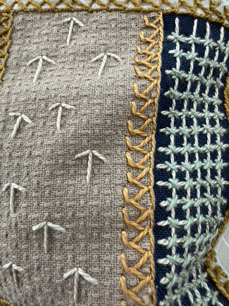 Rosas Design by Pamela Nelson. Hand embroidered on red Honduras Threads