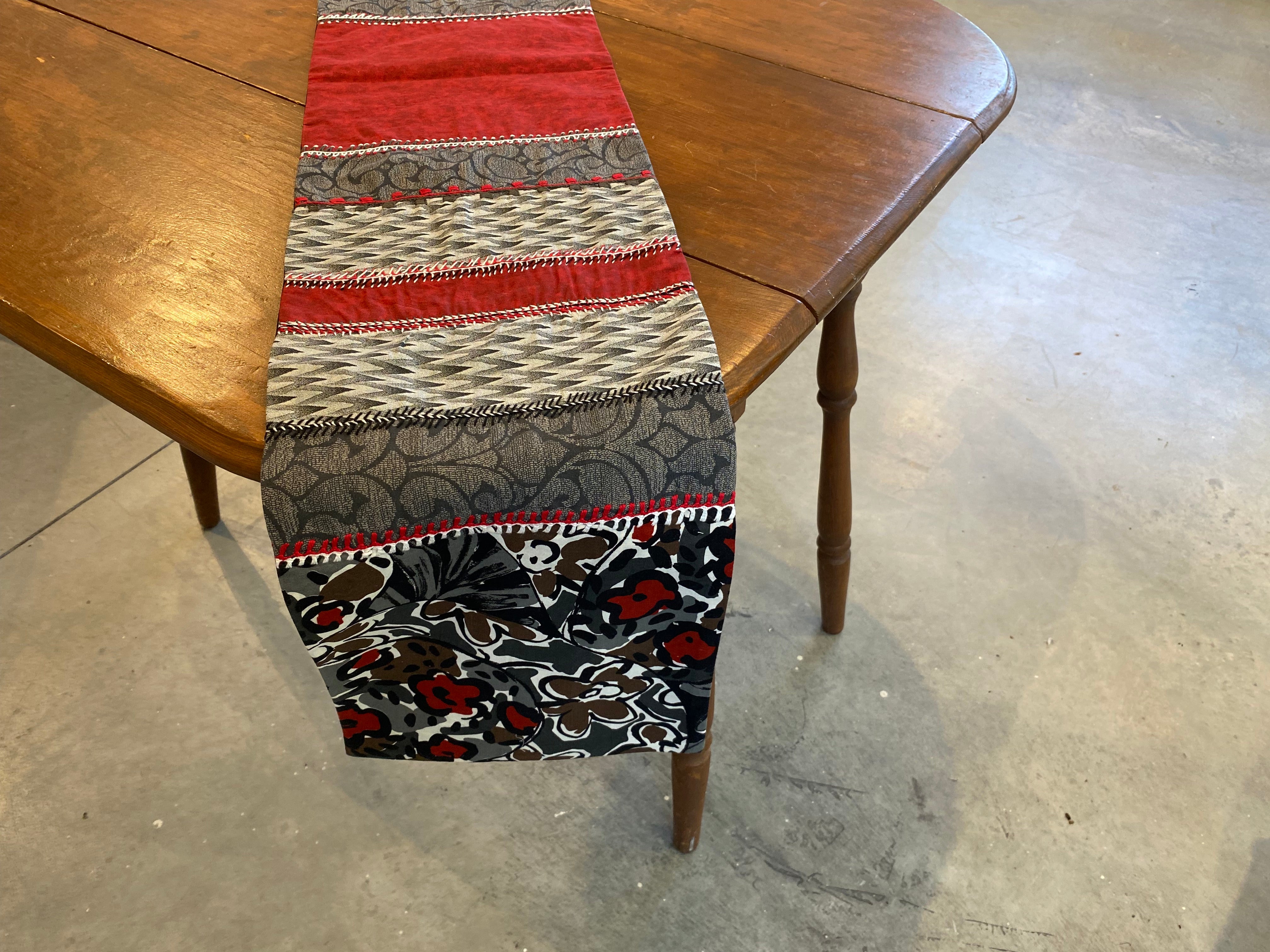 Sonata Design Embroidered Table Runner with red, gray and black Honduras Threads