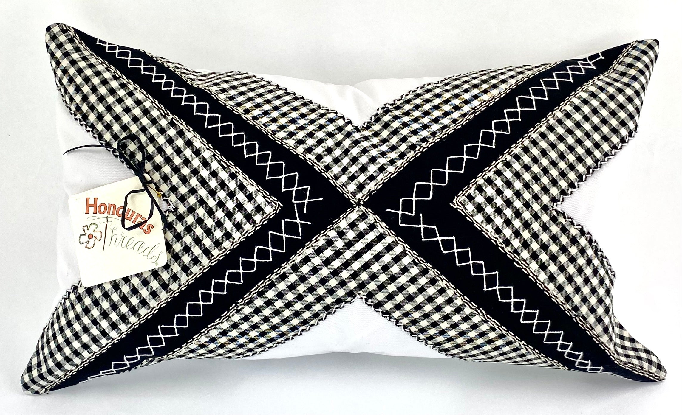 Conexiones Design Embroidered Pillow on white