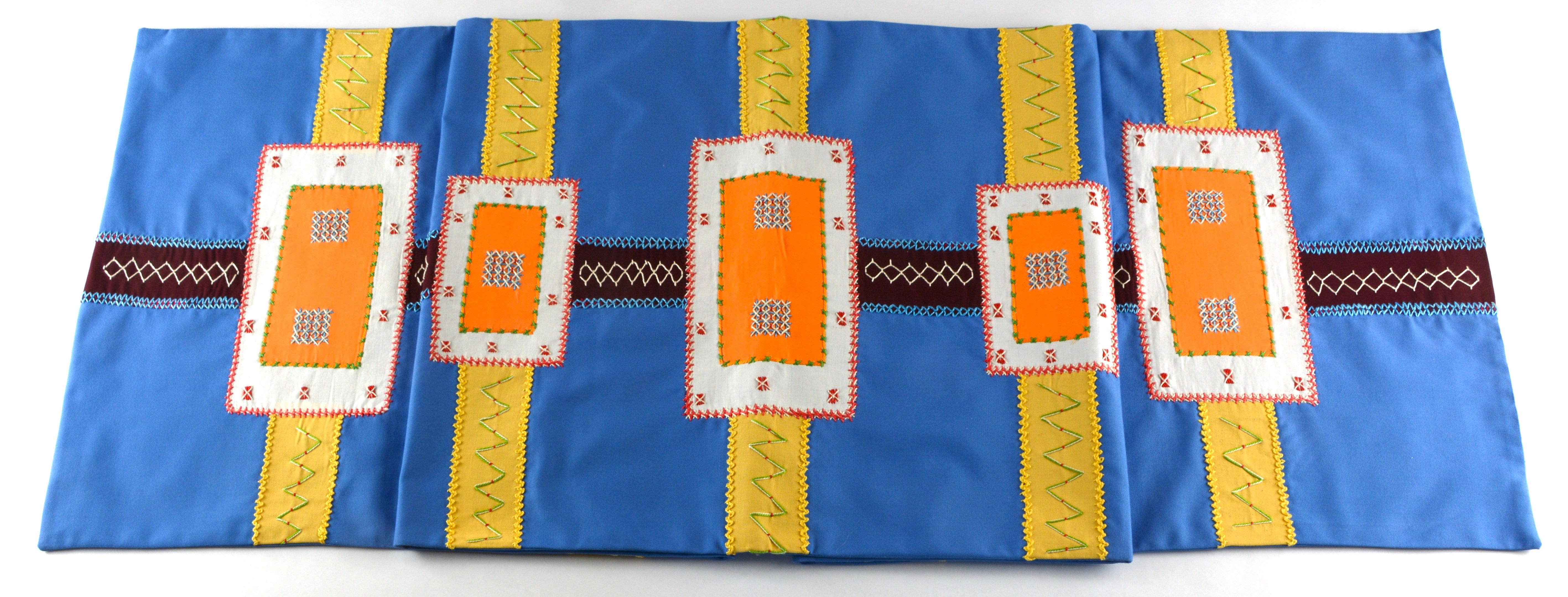 Cinturón Design Embroidered Table Runner on French blue Honduras Threads