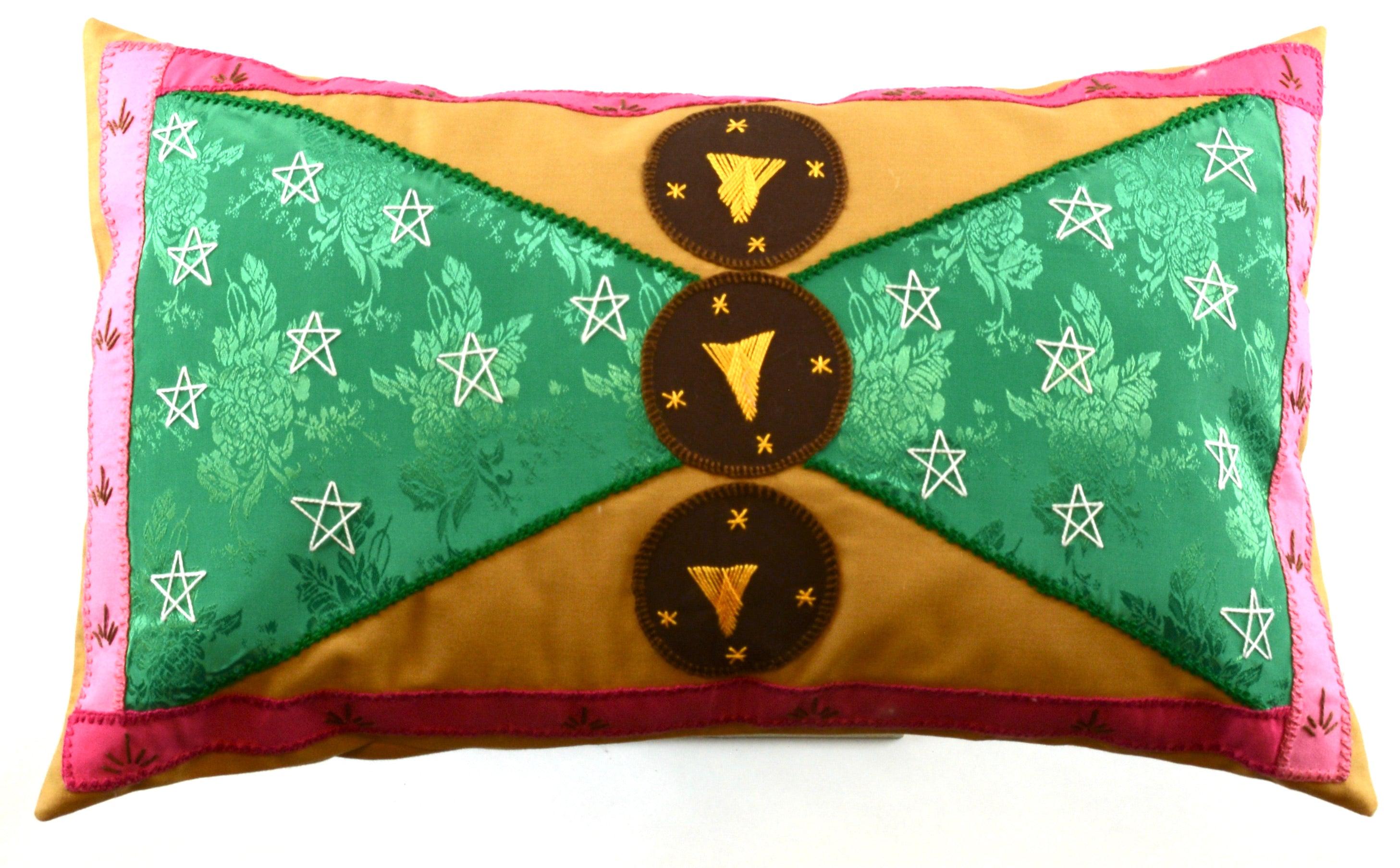 Corbatín Design Embroidered Pillow on caramel Honduras Threads