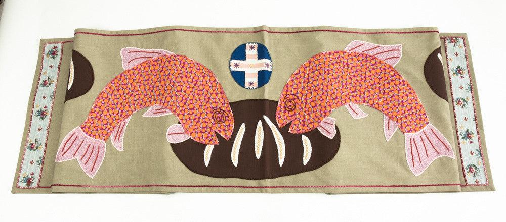 Pan y Pescado Design Embroidered Table Runner on tan Honduras Threads