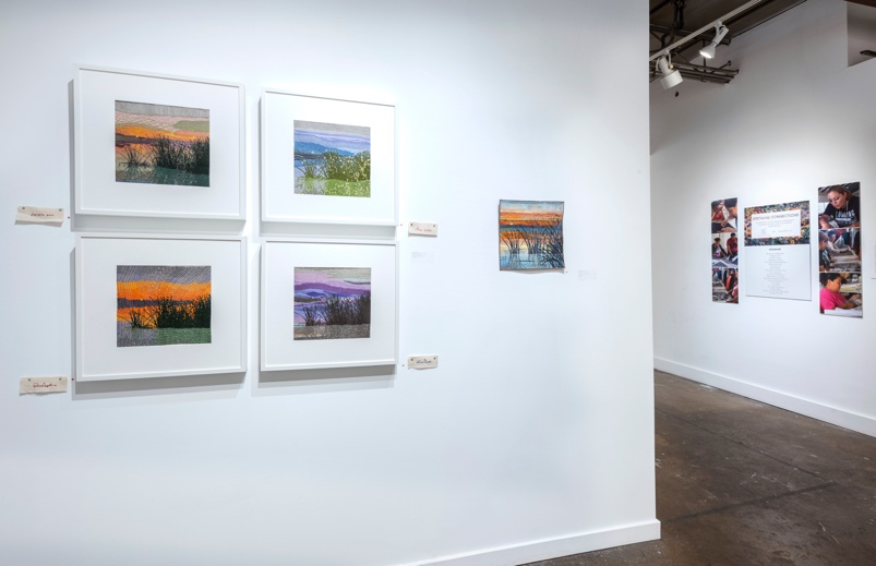 Art gallery with framed photographs on white walls
