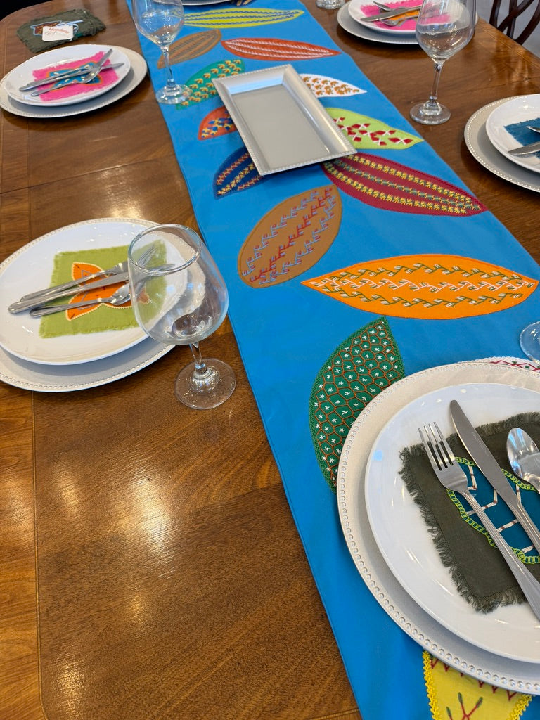 Huellas Design by Pamela Nelson.  Hand Embroidered on blue. (Copy) Pamela Nelson