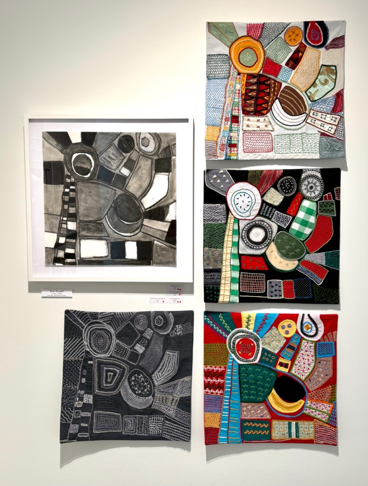 Collection of abstract artworks on a white wall