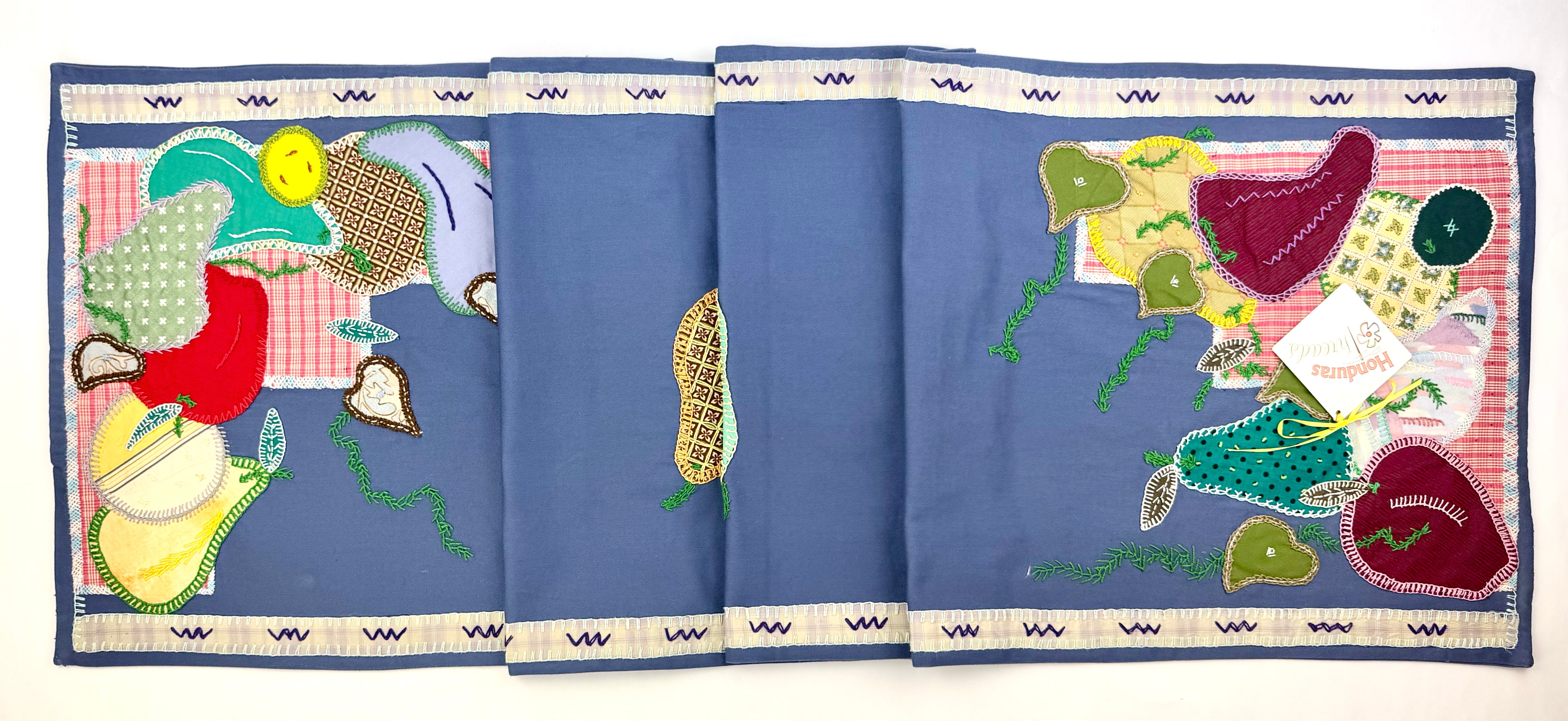 Fruitas Design by Barbara Velhum.  Hand Embroidered on blue. Barbara Velhum