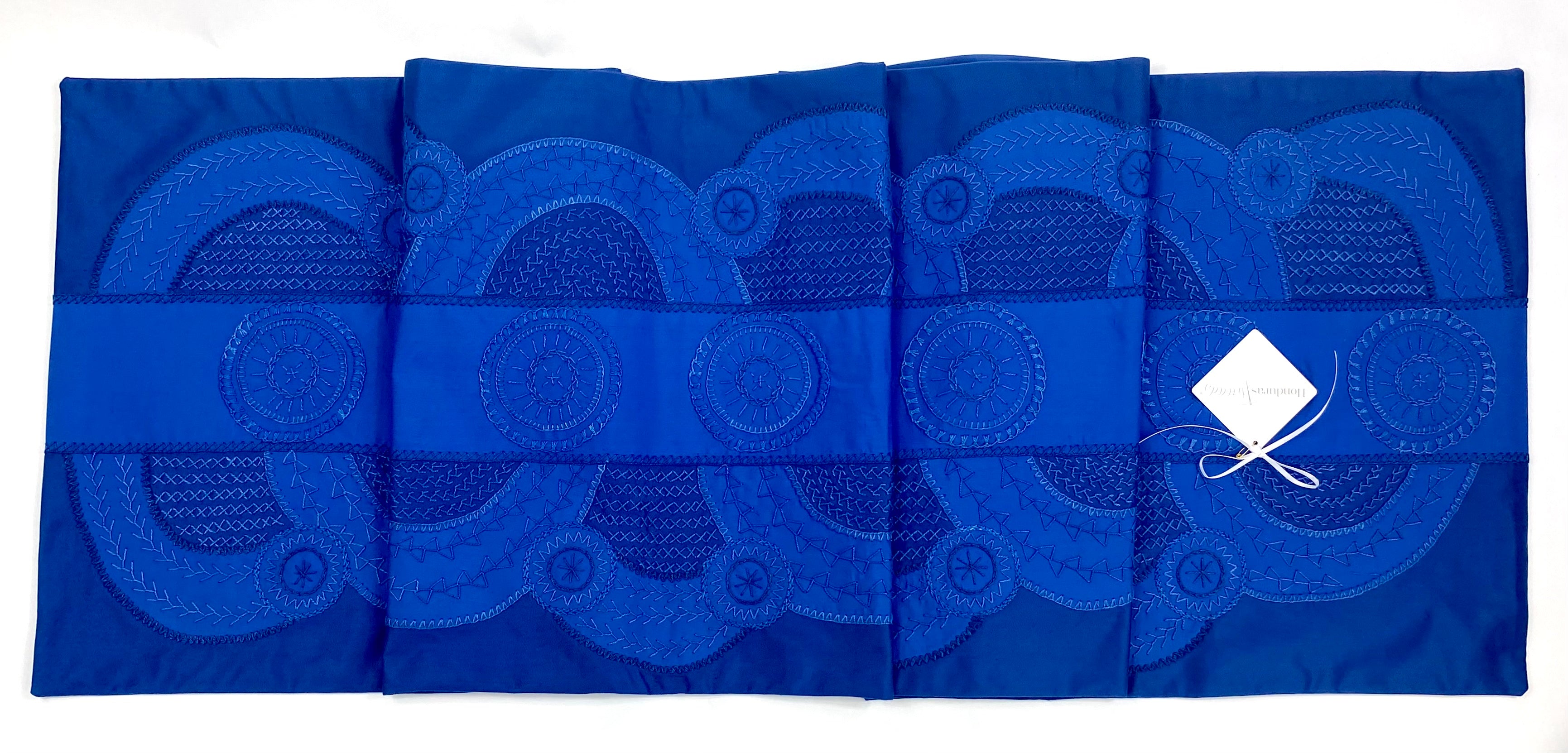 El doce Design Embroidered Table Runner on blue Honduras Threads