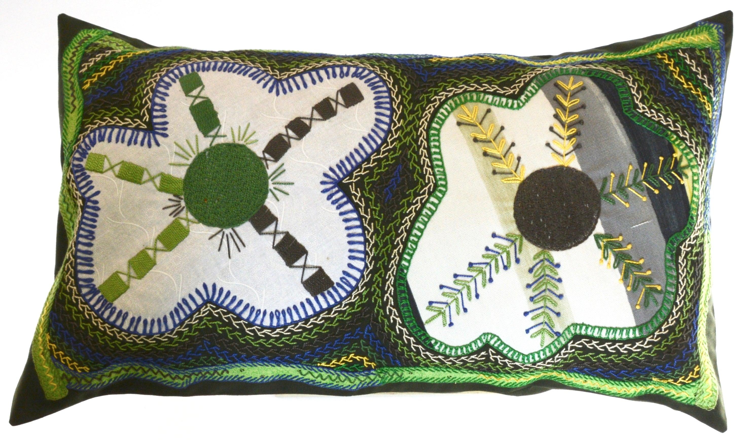 Dos Flores Design Embroidered Pillow on dark green Honduras Threads