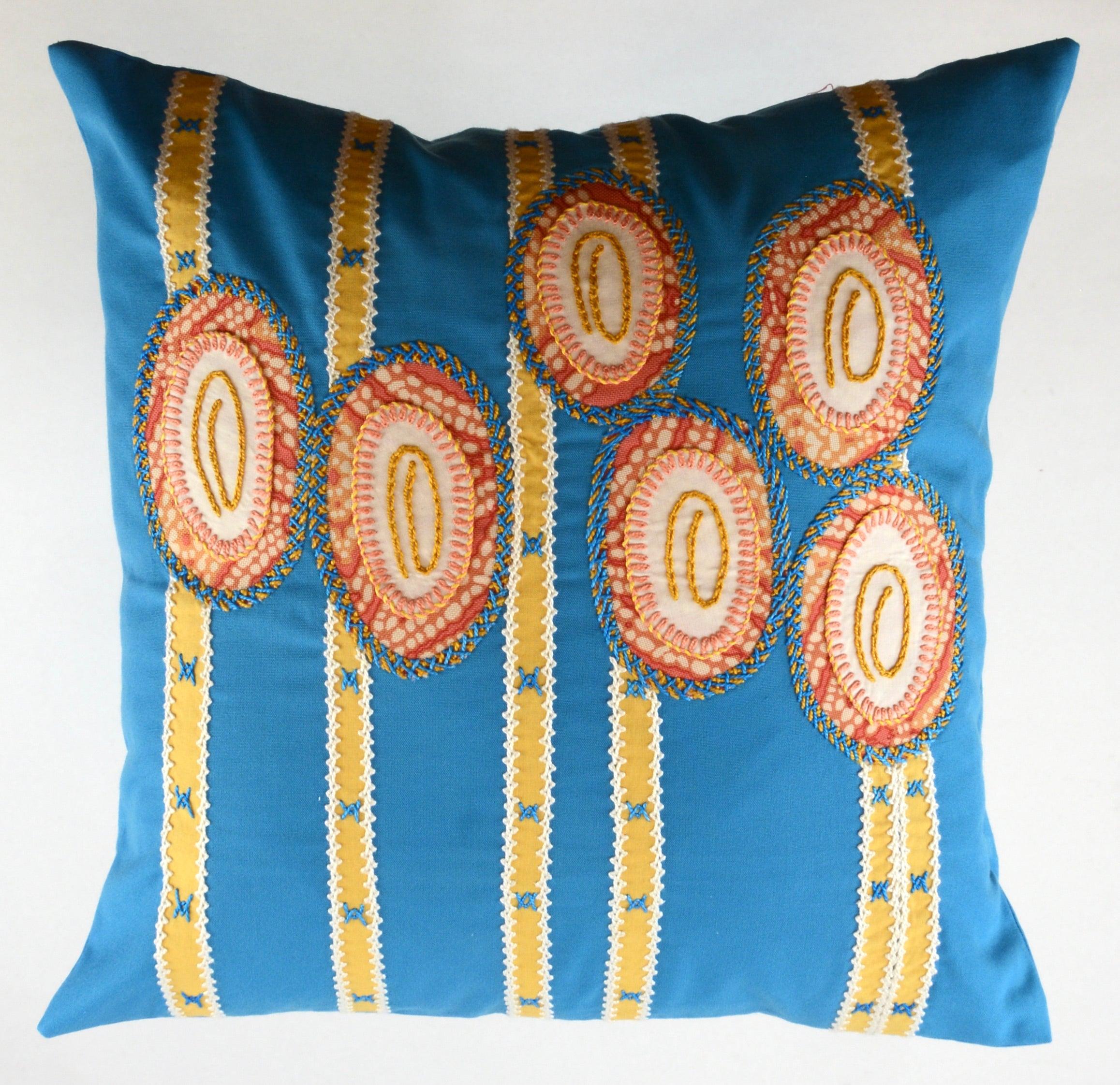 Maracas Design Embroidered Pillow on turquoise Honduras Threads