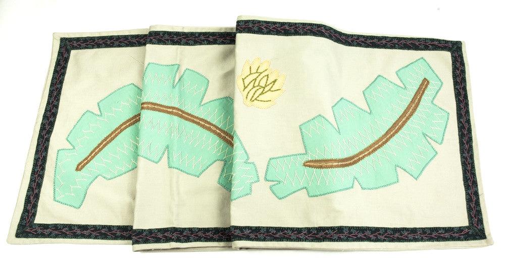 Hojas Design Embroidered Table Runner on stone Honduras Threads