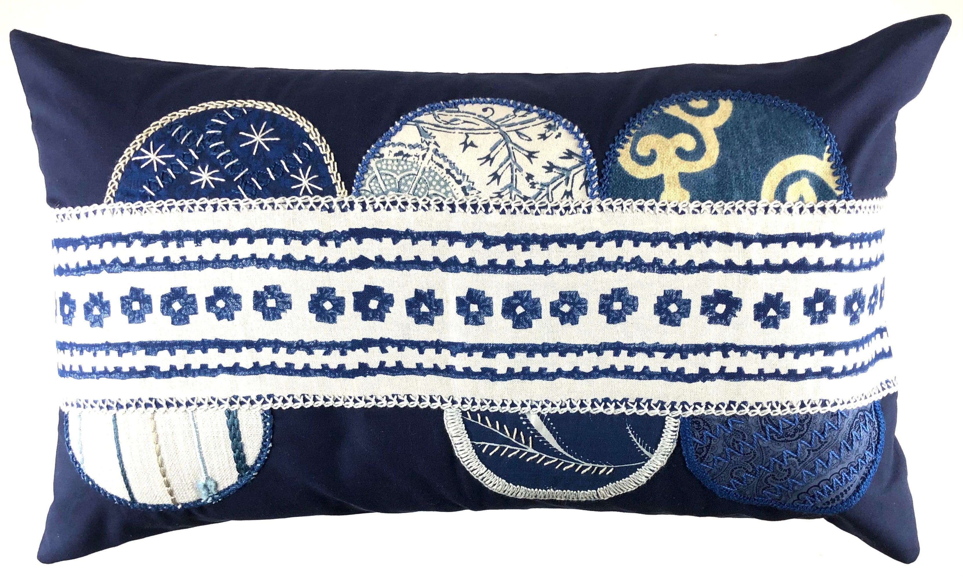 Piedras Lunar Design Embroidered Pillow on navy Honduras Threads